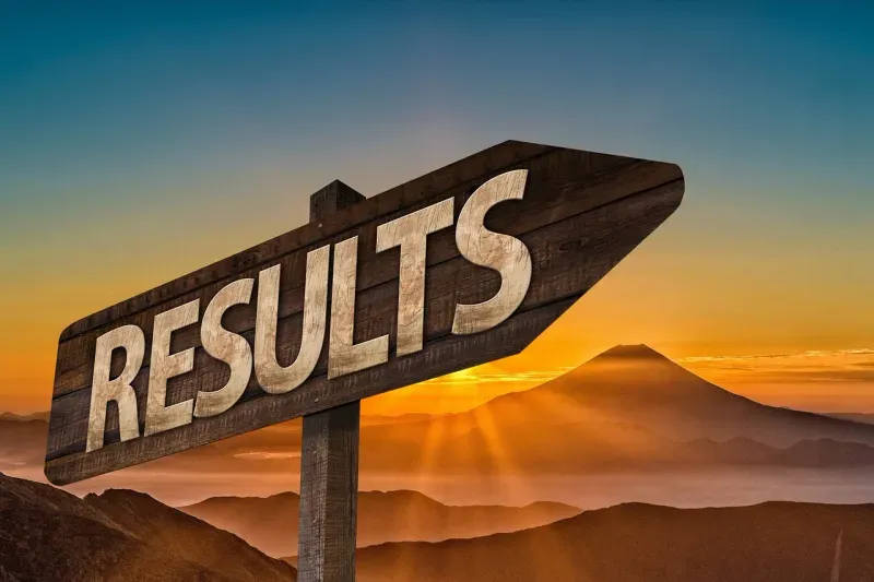 Sign pointing to results
